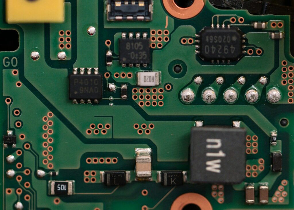 Close-up of a green circuit board with electronic components