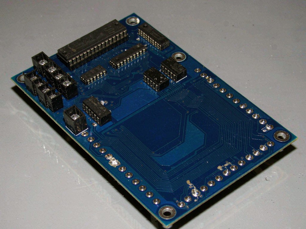 Double-sided rigid PCB with plated through-holes