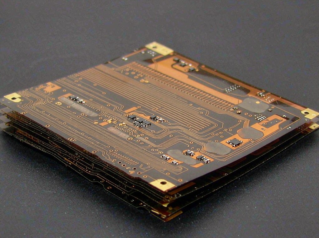 Multi-layer flexible PCB with stiffened SMT zones